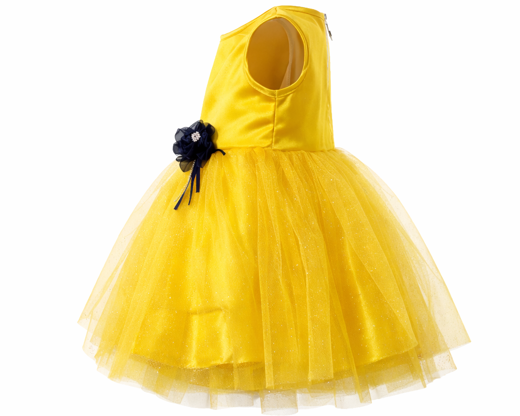 Yellow dress with a black flower detail on a white background