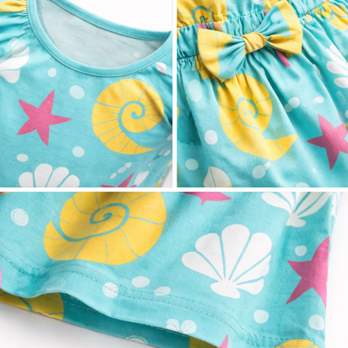 Children's dress with shell and starfish pattern on a white background